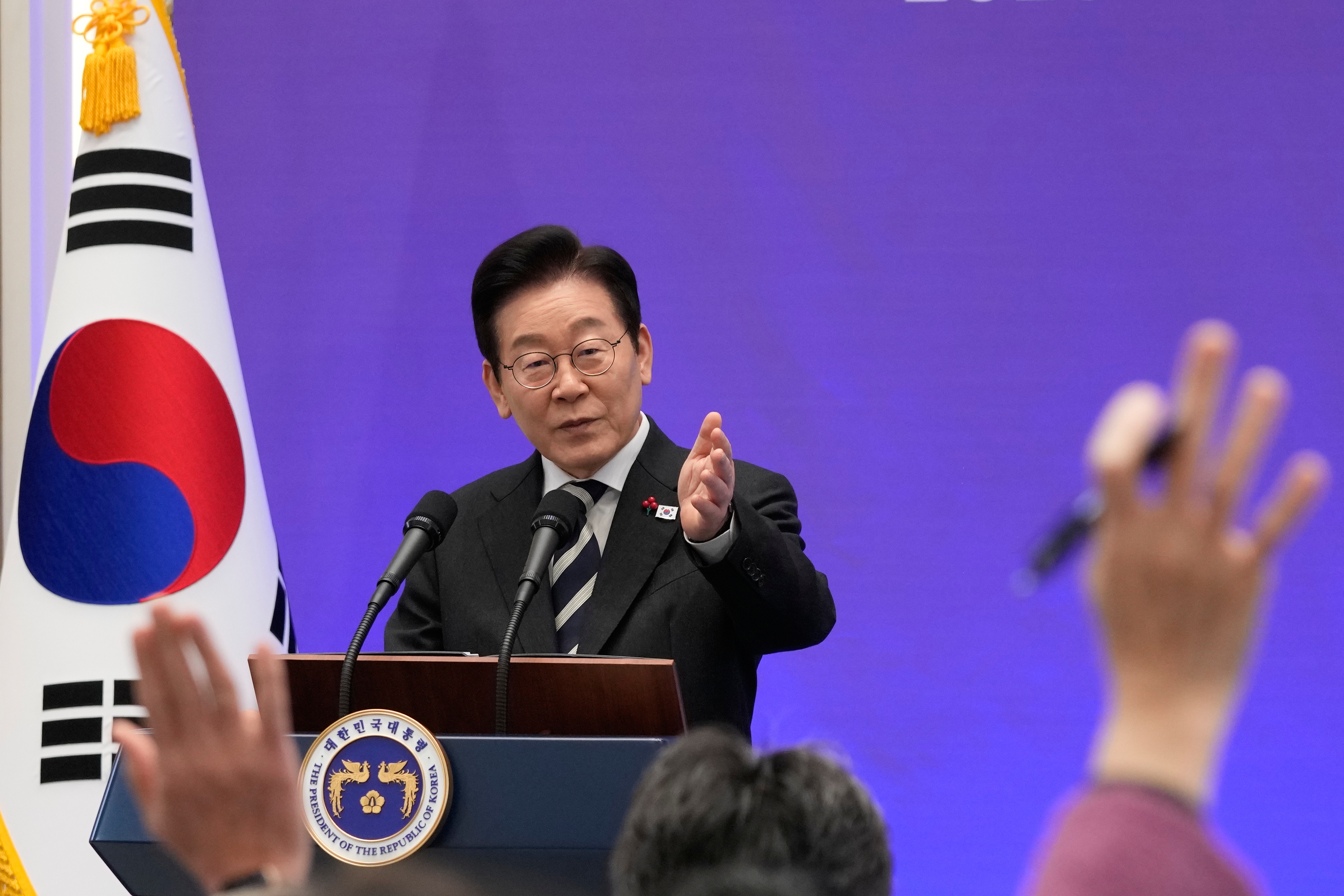 South Korean President Lee Jae Myung gestures during a news conference to mark the first  anniversary of the Dec. 3 martial law crisis at the Blue House in Seoul, South Korea on Wednesday.